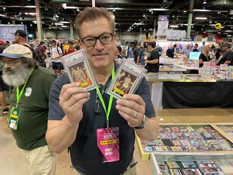 jon ogg holding collectible baseball cards